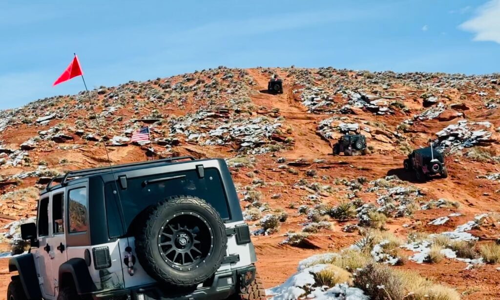 Picture of Jeeps climbing a hill.